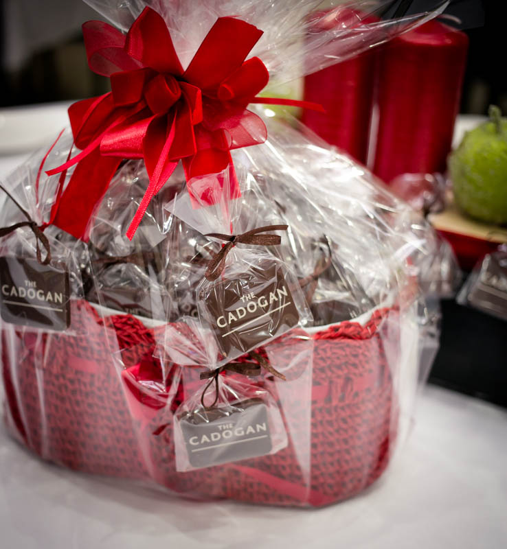 Corporate Gift Baskets - 550g Crocheted basket filled with 50 pcs of 7 g promotional chocolate bars